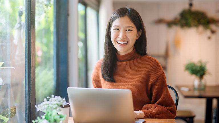 smiling woman on laptop